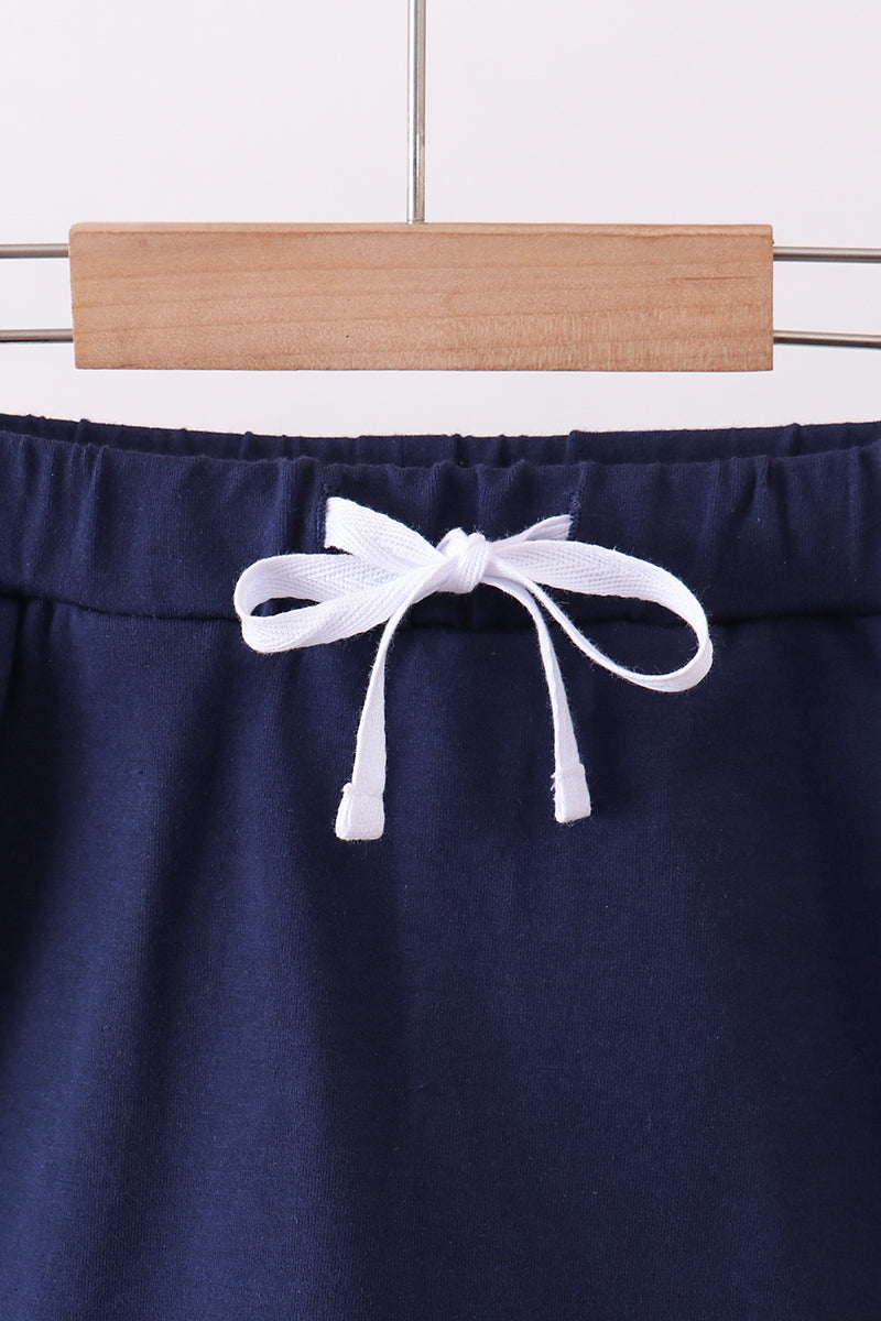 Navy scallop hem bow skort
