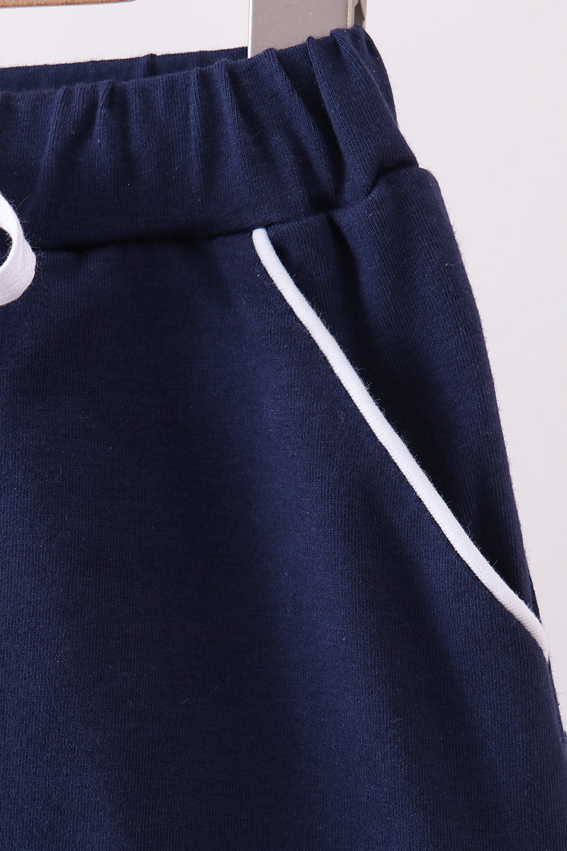 Navy scallop hem bow skort