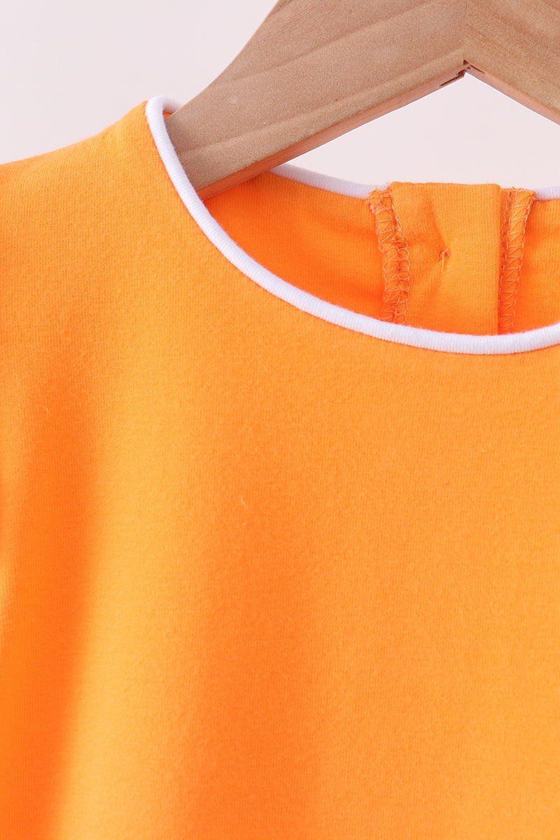 Orange flutter sleeve scalloped top