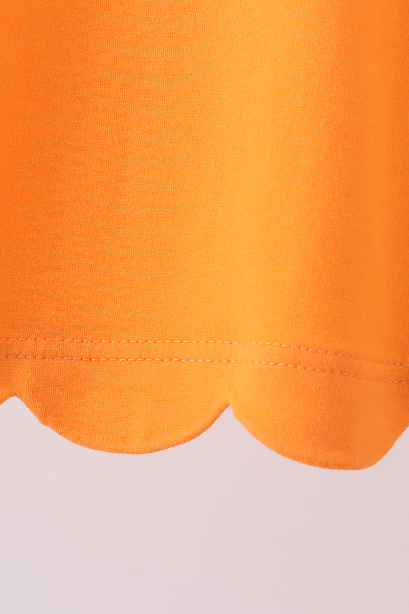 Orange flutter sleeve scalloped top