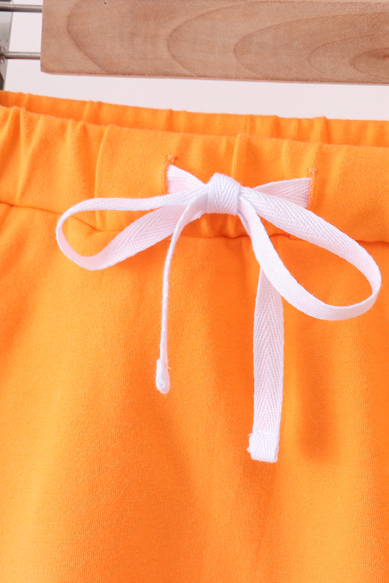 Orange scallop hem bow skort