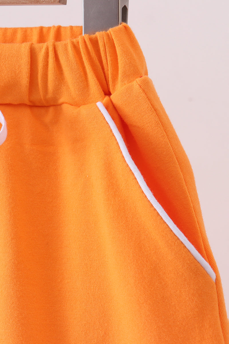 Orange scallop hem bow skort